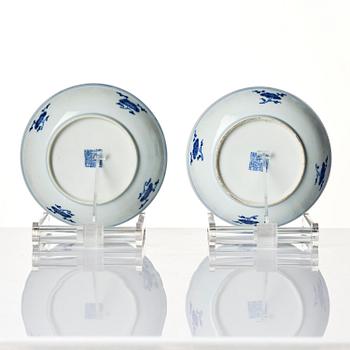 A pair of blue and white floral dishes, Qing dynasty, with Qianlong mark and of the period (1736-95).