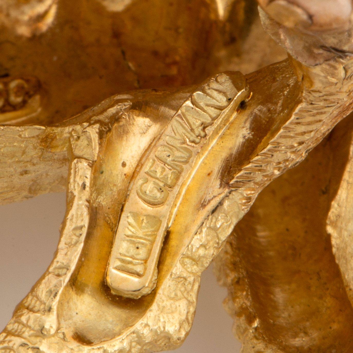 A Tiffany brooch in 18K gold set with sapphires designed as a zebra.