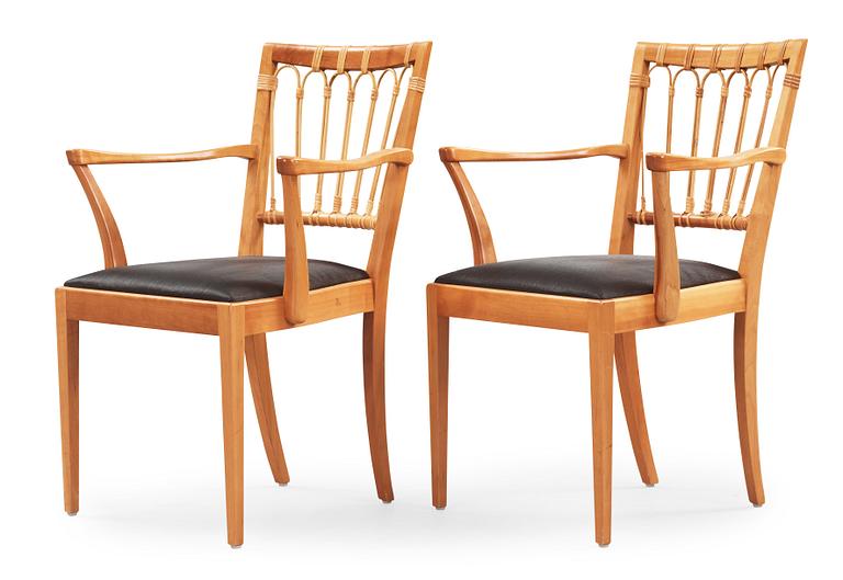 A pair of Josef Frank mahogany and rattan armchairs, Svenskt Tenn, model 1165.