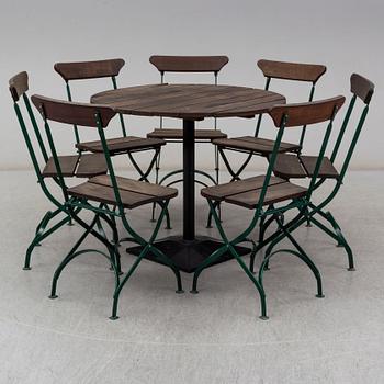 A Swedish garden table and seven chairs, Byarums bruk, late 20th or early 21th century.