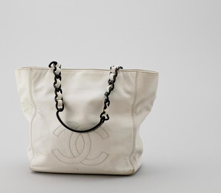 A white leather handbag by Chanel.