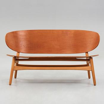 A HANS J WEGNER, a  "Shell set/ Skalsæt" comprising a sofa, a chair and a table, Fritz Hansen, Denmark 1950's.