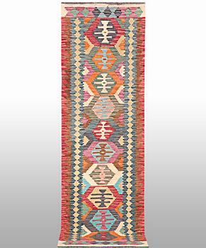A Kilim runner, a. 294 x 82 cm.