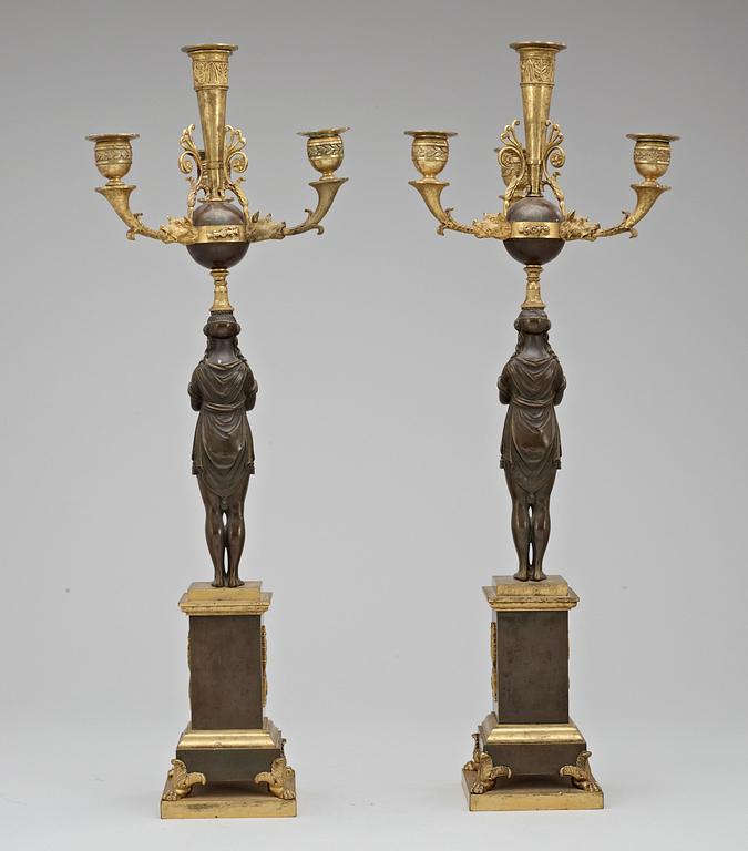 A pair of French Empire early 19th century four-light candelabra.