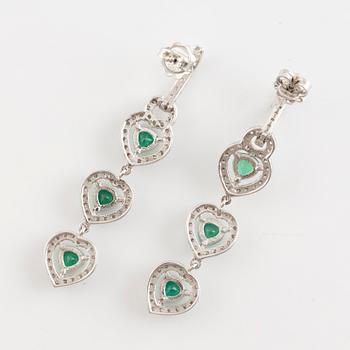 Emerald and brilliant cut diamond earrings.