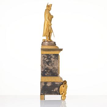 A French Empire ormolu and silvered bronze figural mantel clock, first part of the 19th century.