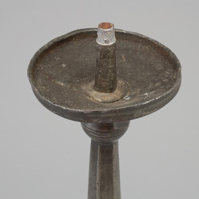 A 17th century pewter candlestick.