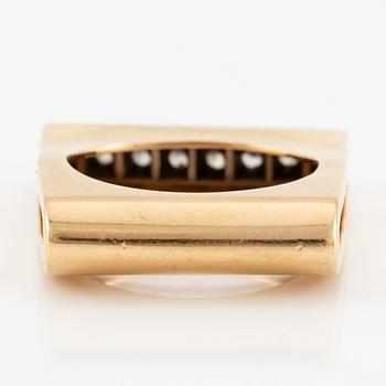 A W.A. Bolin ring in 18K gold set with round brilliant-cut diamonds.