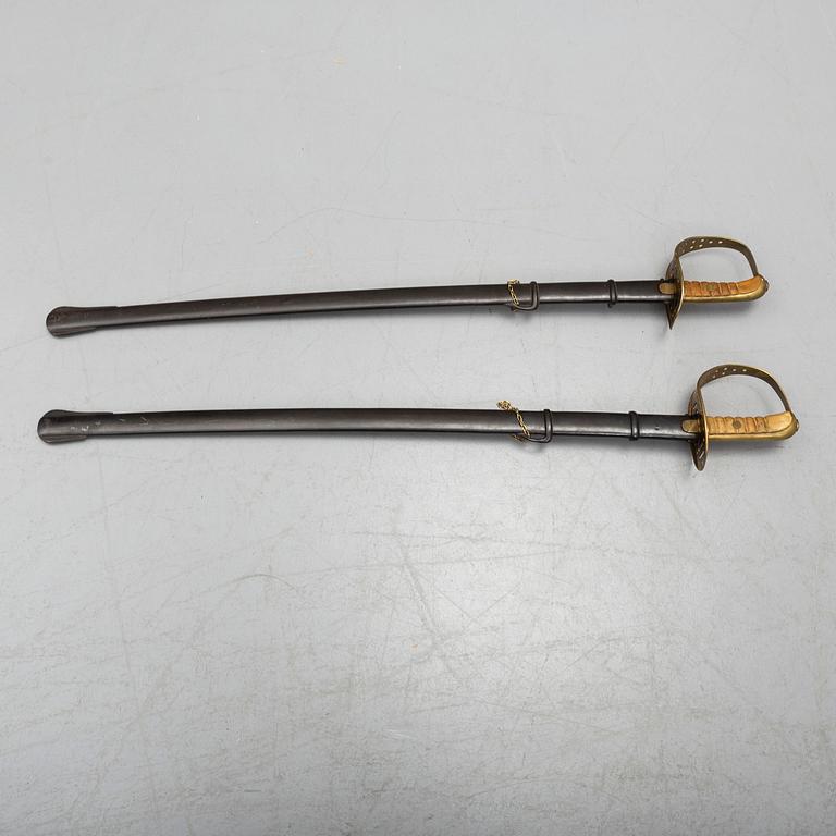 Two cavalry sabres 1867 pattern with scabbards.