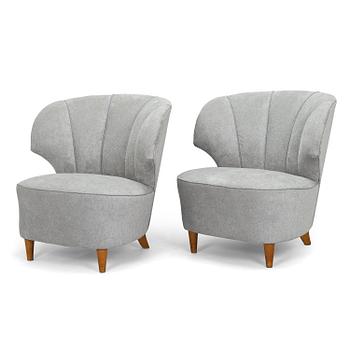 A pair of mid 20th century armchairs.