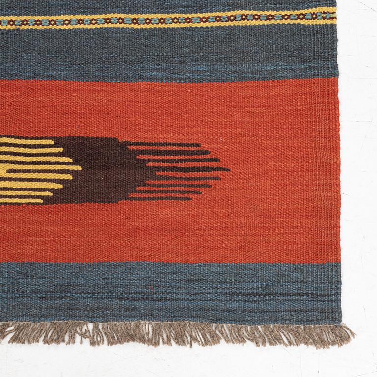 A kilim rug, c 242 x 181 cm.