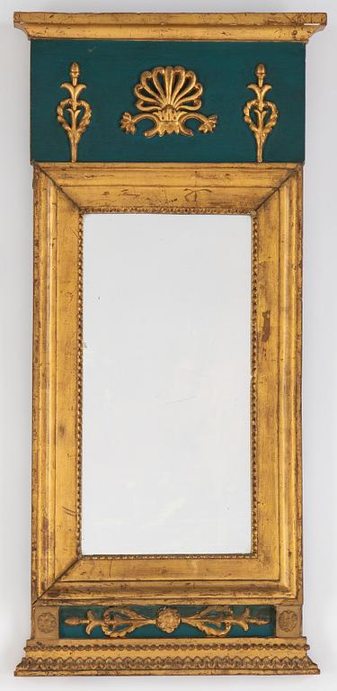 An Empire mirror, first half of the 19th century.