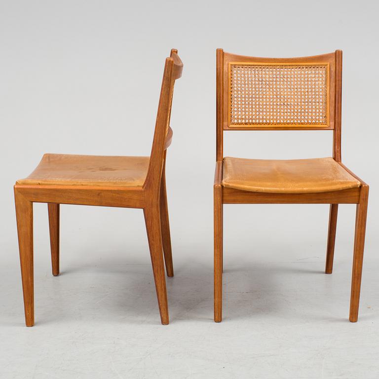 Four teak and rattan chairs, dated 62.