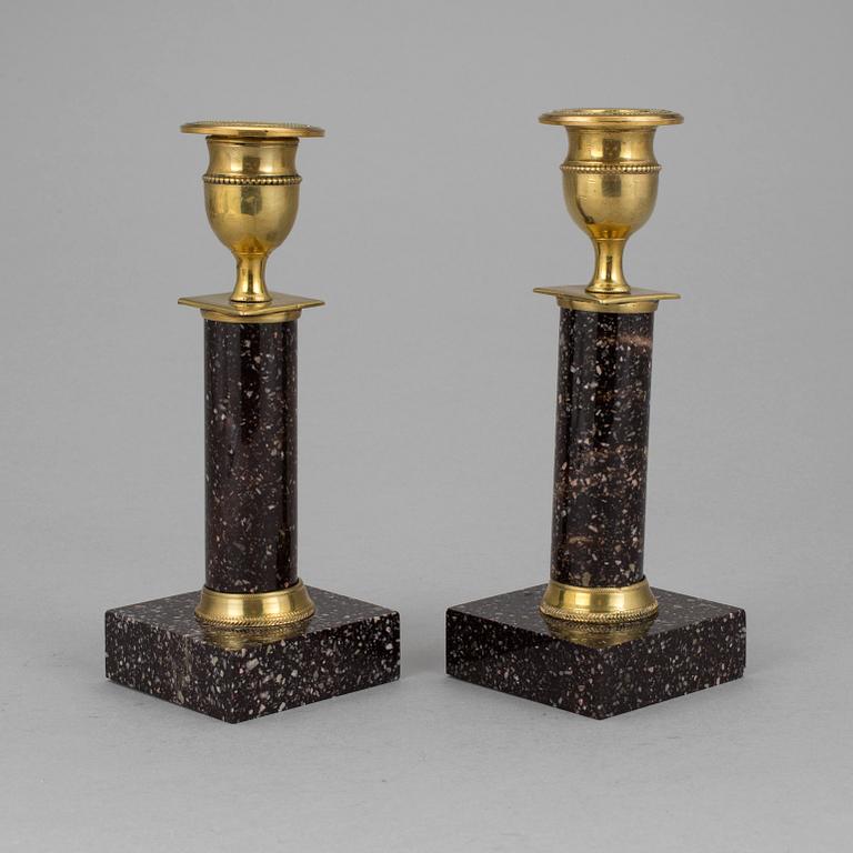 A pair of late gustavian porphyry candle sticks early 19th century.