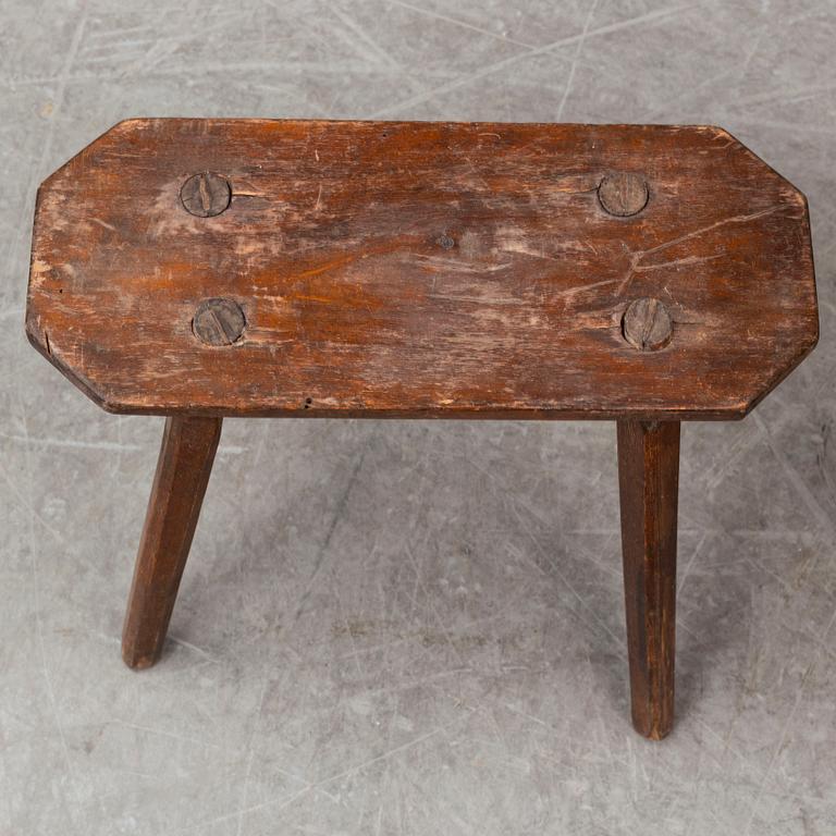 a swedish wooden chair with a stool from the 19th century.