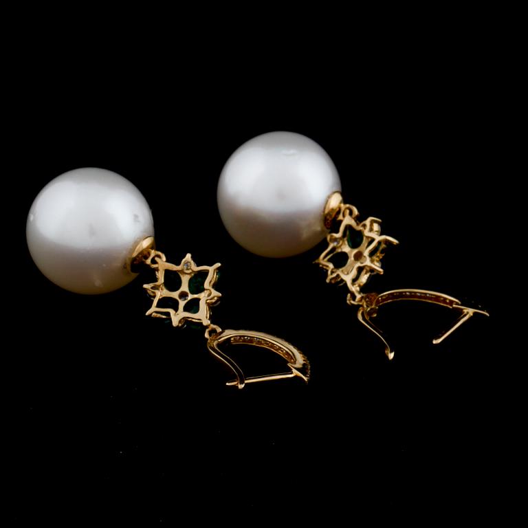 A pair of cultured pearl, emerald and brilliant cut diamond earrings.