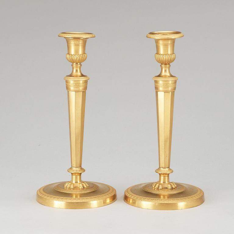 A pair of French Empire early 19th Century candlesticks.