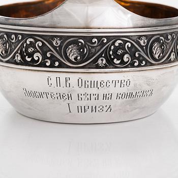 A parcel-gilt kovsh, maker's mark of Mikhail Tarasov, Moscow 1908-14. Length 40 cm.