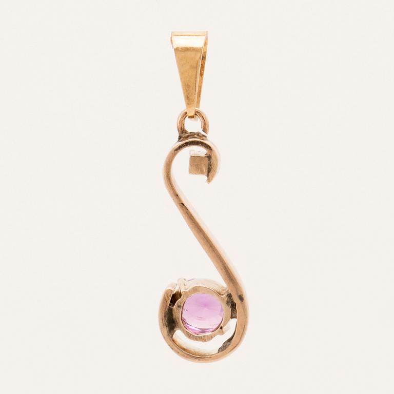 Pendant in 18K gold with an oval faceted pink sapphire and a round brilliant-cut diamond.