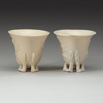 A pair of blanc de chine libation cups, Qing dynasty 18th century.