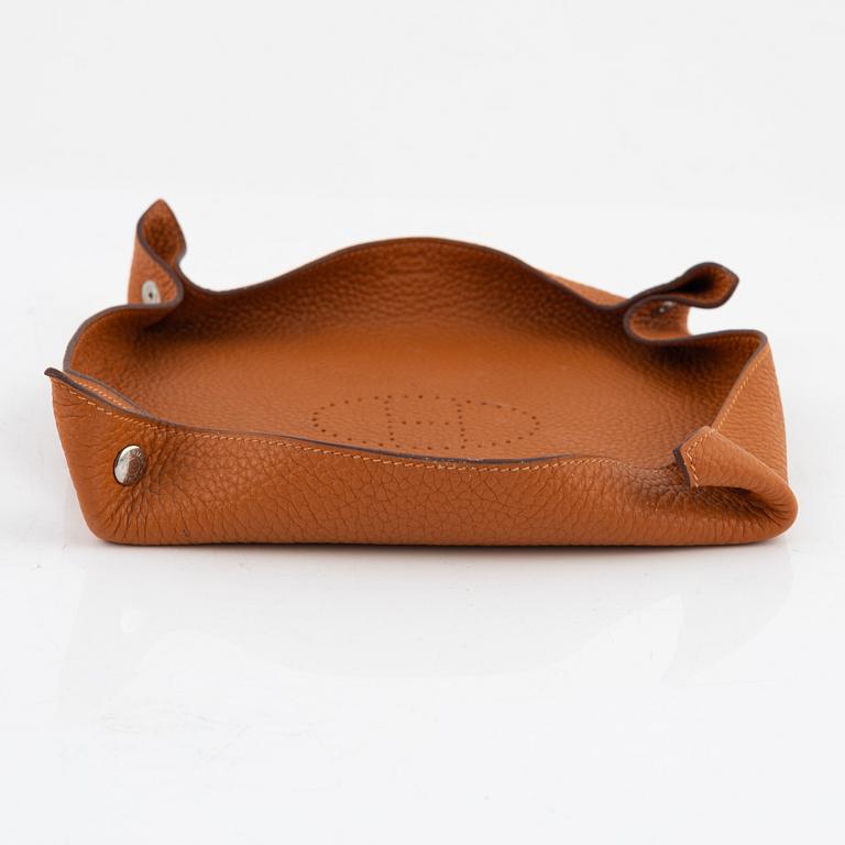 Hermès, an orange Clemence 'Mises et Relances' change tray, 2012.
