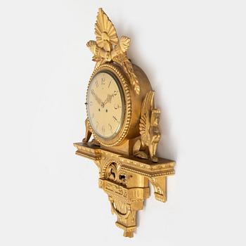 An Empire style wall clock, mid 20th century.