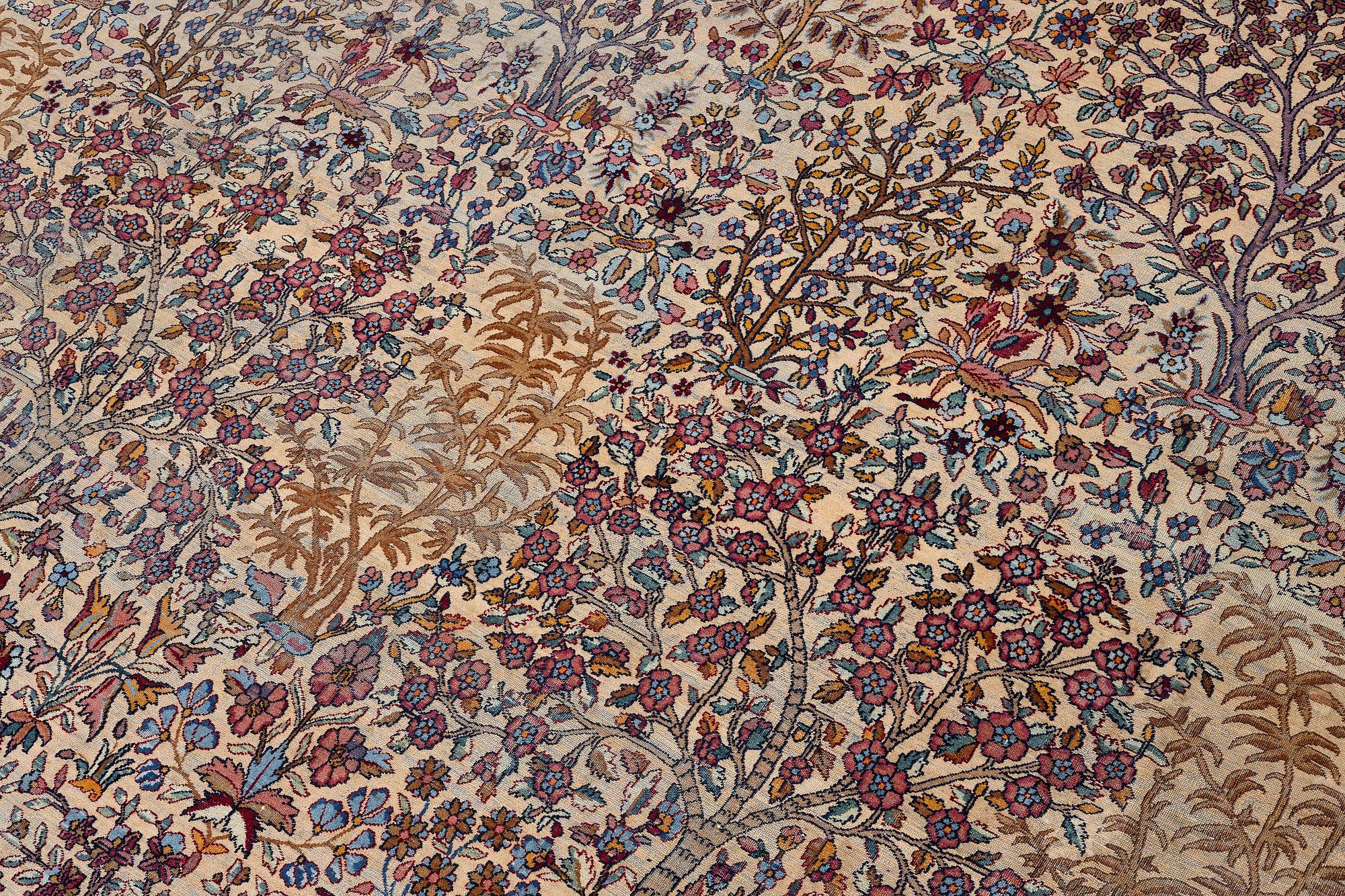 An antique 'Millefleur' Kerman Laver carpet, c. 964 x 426 cm.