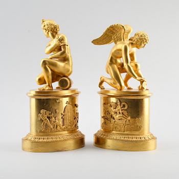 A pair of early 19th century Empire gilt bronze table sculptures.