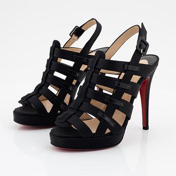 Christian Louboutin, a pair of black silk sandals, size 37 1/2.
