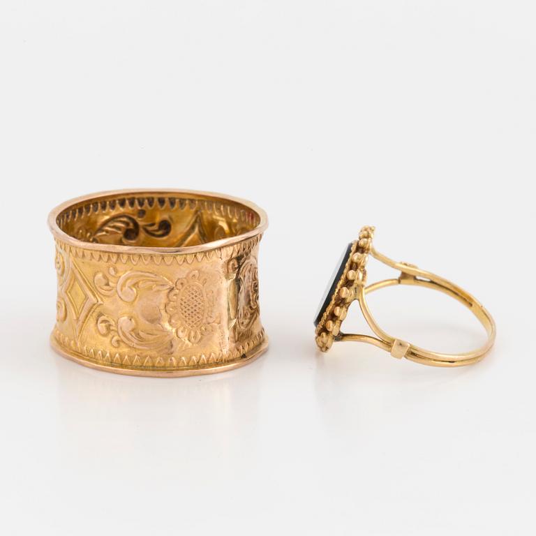 Two 18K gold rings.