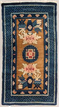 A semiantique Chinese Baotou carpet ca 130x69 cm.