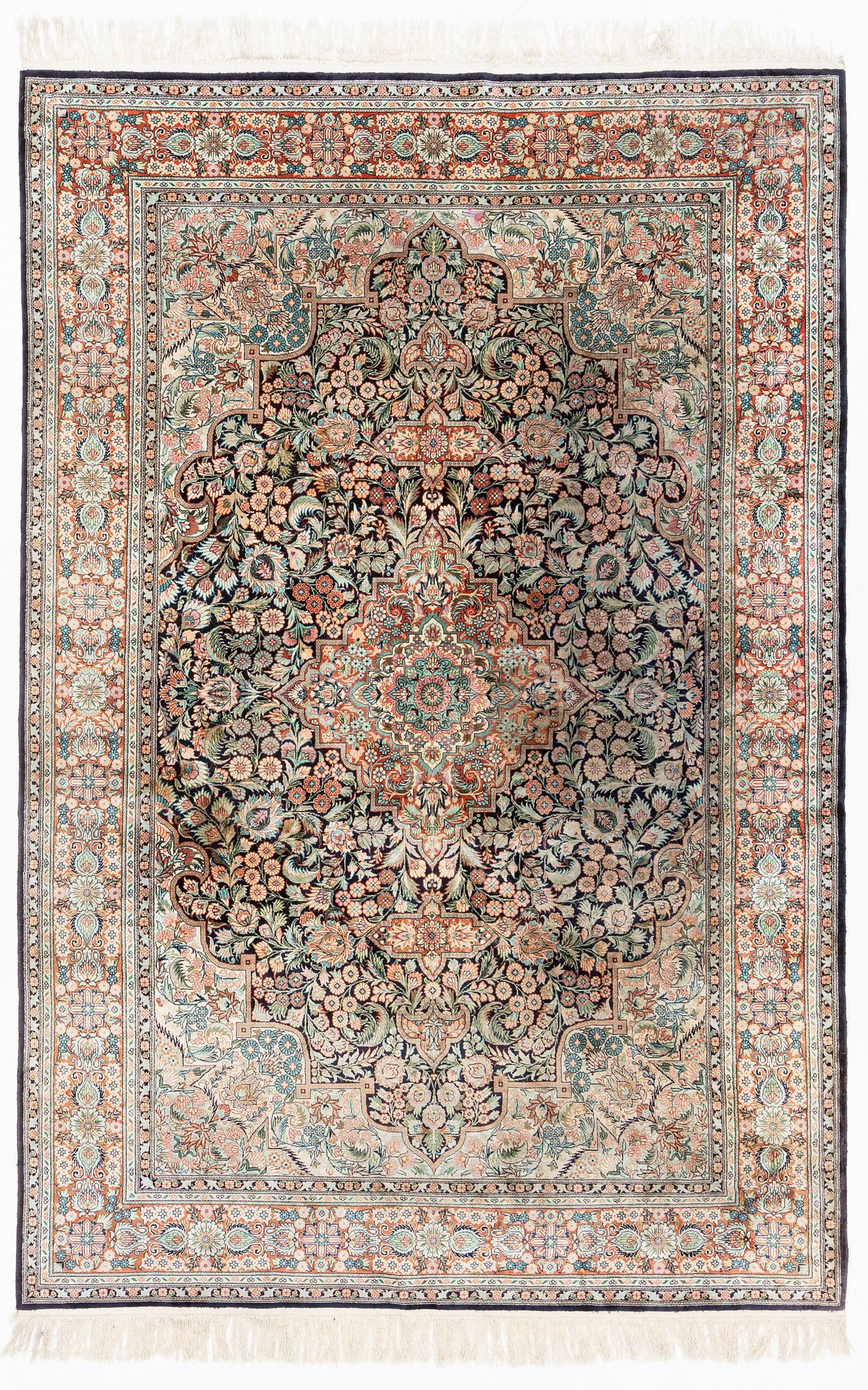 An oriental carpet, mercerized cotton, c. 275 x 182 cm.