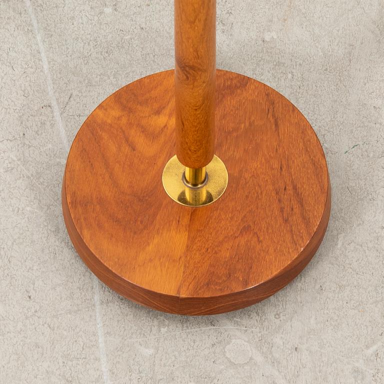 A brass and teak floorlamp from the mid 1900's.