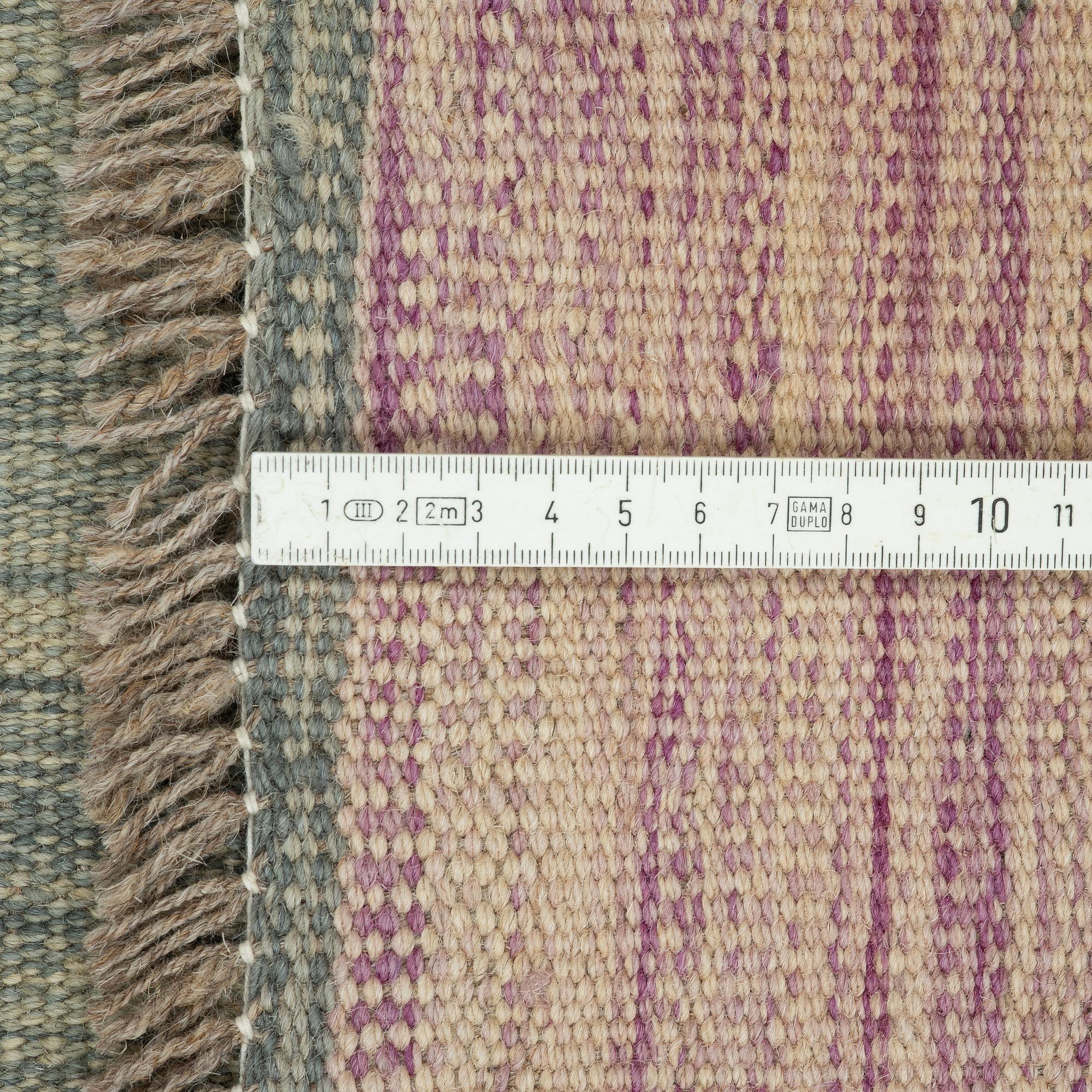 A kilim rug, ca 252 x 175 cm.