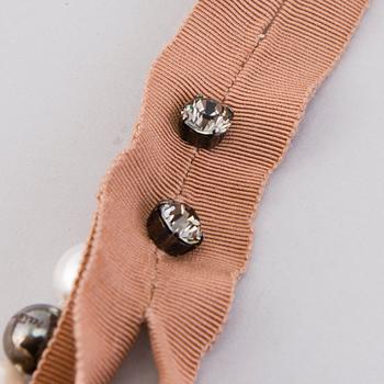 LANVIN Happy Pochette, Necklace and a brooch.