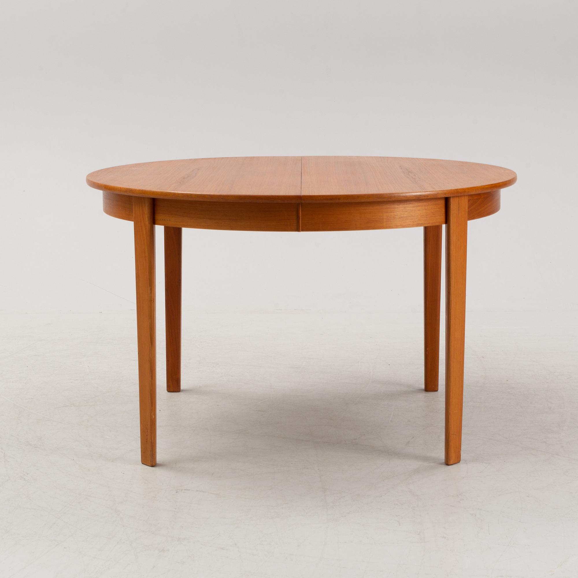 A 1950's/60's teak-veneered dining table.