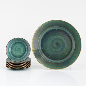 Josef Ekberg, 11 ceramic side plates and a dish, Gustavsberg, 1920's.