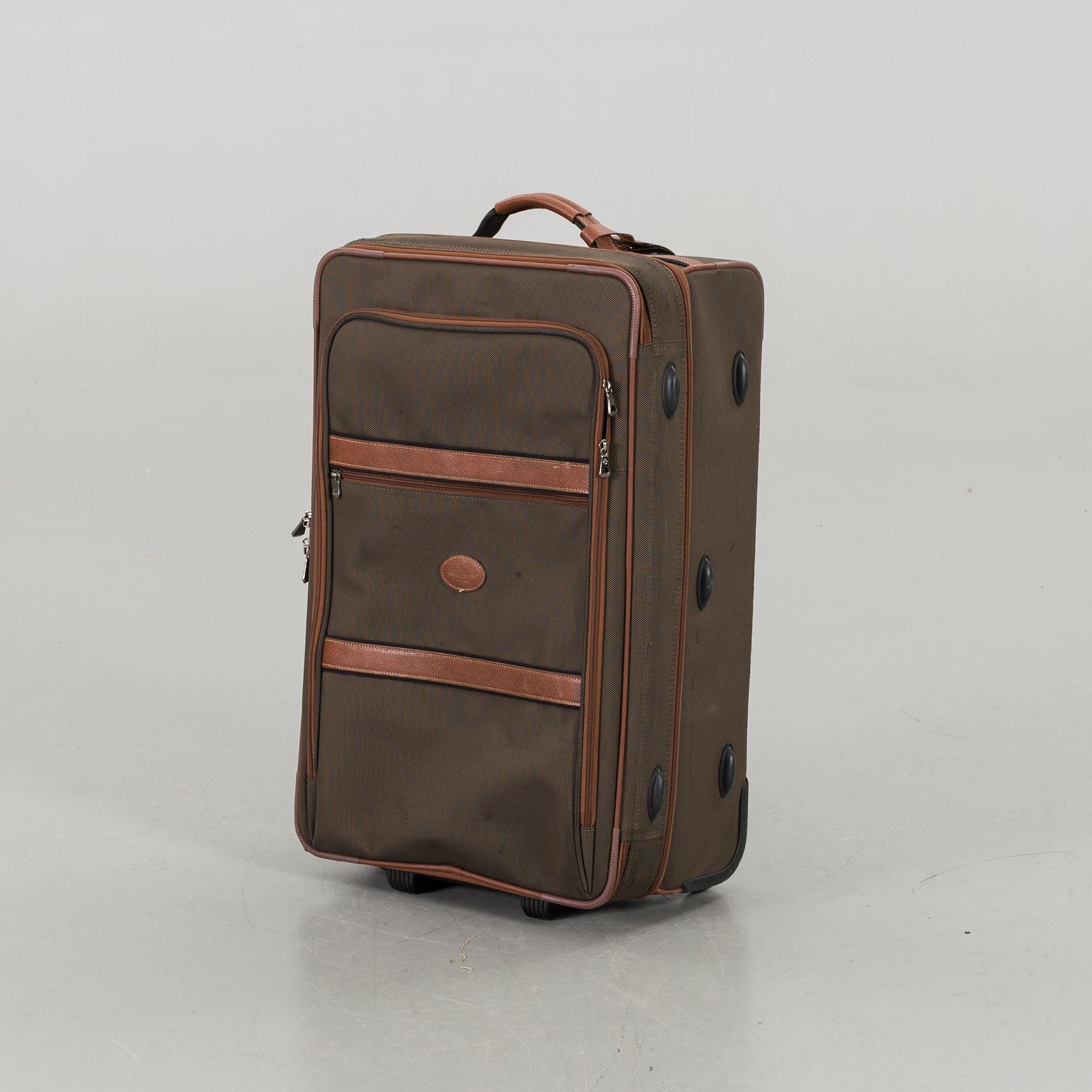A LONGCHAMP SUITCASE.