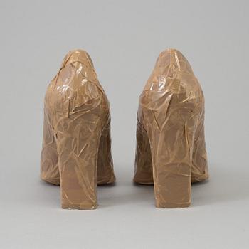 ANN-SOFI BACK, a pair high heel shoes.