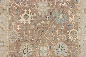 An Ushak design carpet, a. 423 x 305 cm.