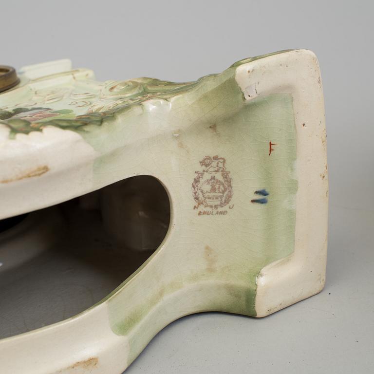 A creamware mantle clock, circa 1900.