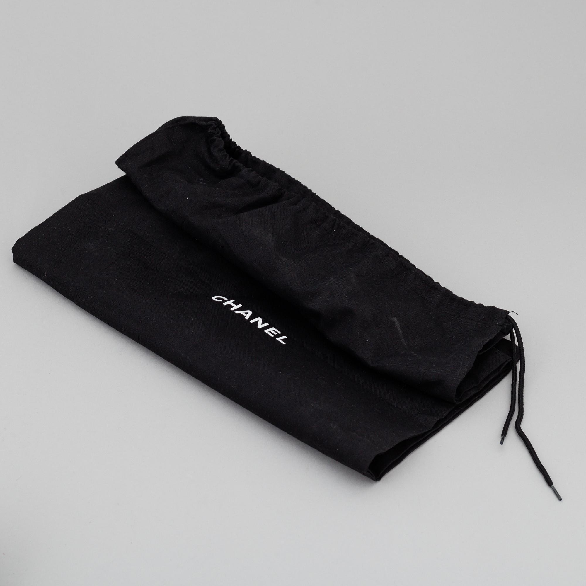 CHANEL, a pair of black leather boots, size 35,5.