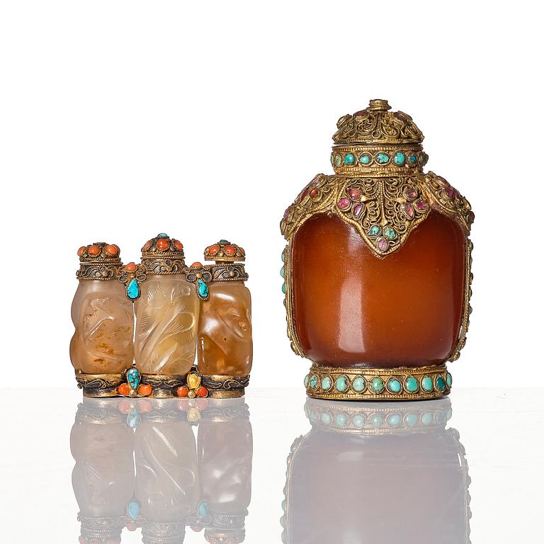 A set of four Chinese snuff bottles and a sculpture, 20th Century.