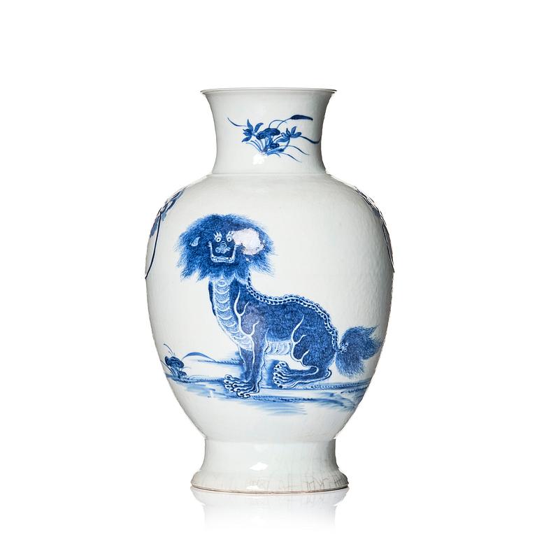 A blue and white bronze shaped vase with mythical creatures, Qing dynasty, 19th Century.