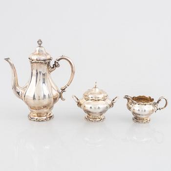 A silver coffee pot, cream jug and sugar bowl, Swedish import marks Torndahl-Ekström, Stockholm 1921.