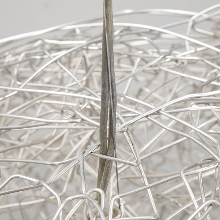 A 'Fil de Fer Ovale' ceiling light by Enzo Cattelini.