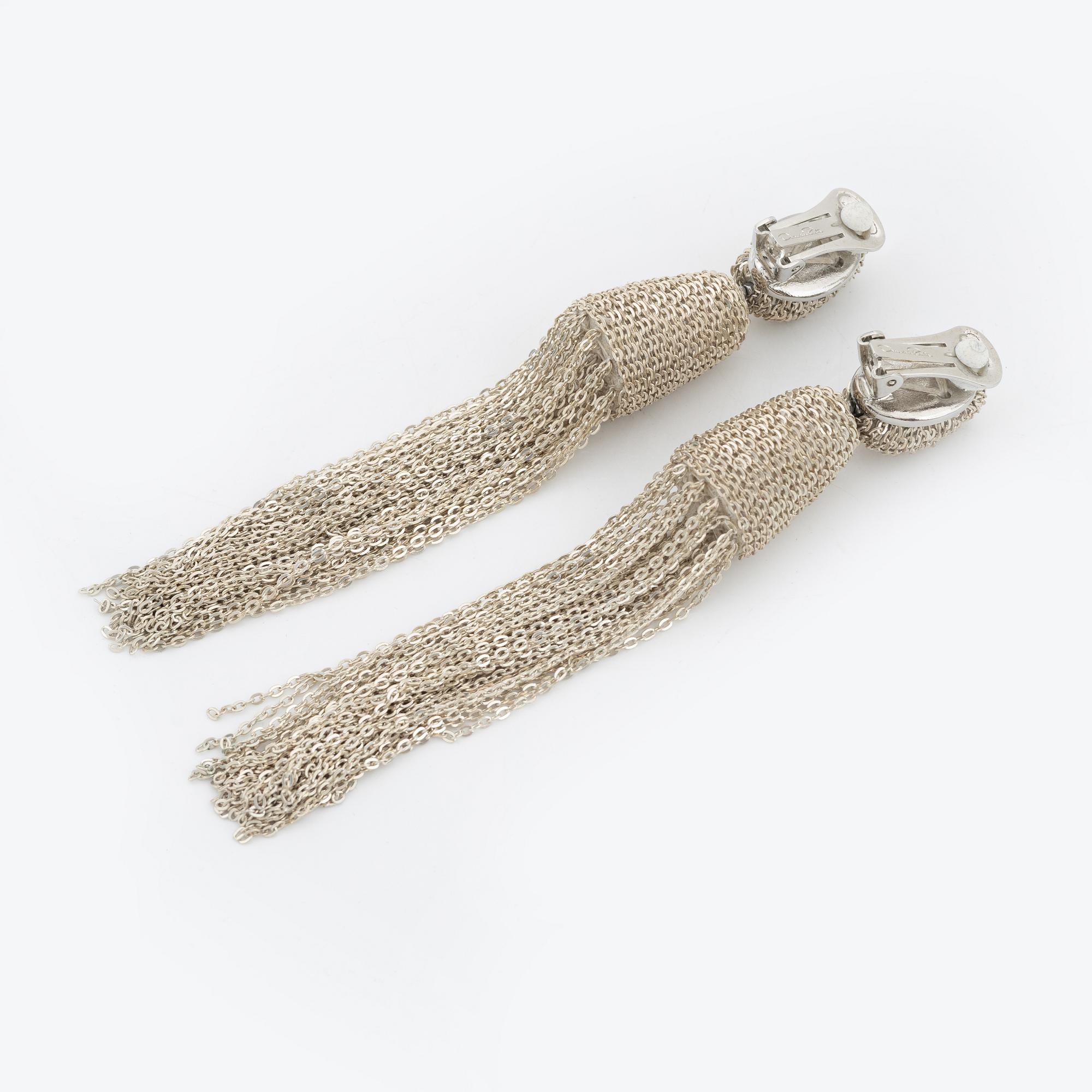 Oscar De La Renta, a pair of clip-on silver chain tassel earrings.