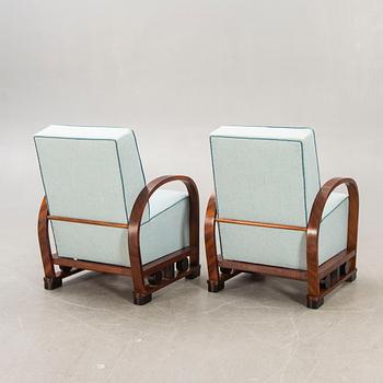A pair of Art deco walnut armchairs first half of the 20th century.