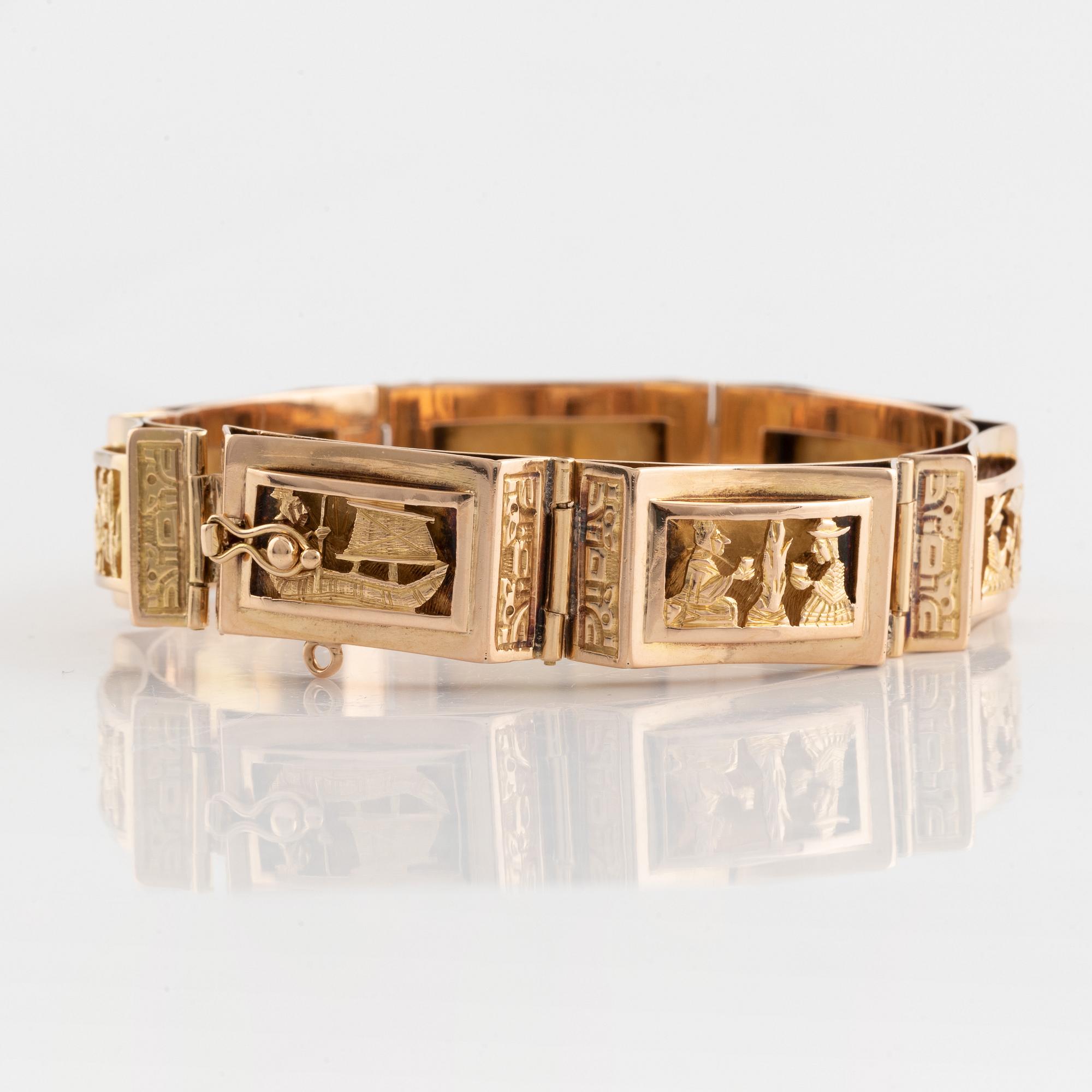 Gold panel bracelet.
