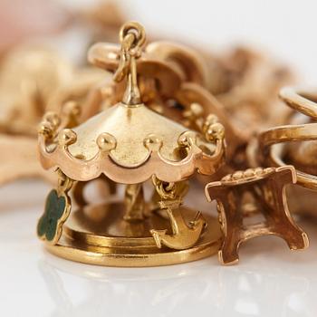 An 18K gold charm bracelet.